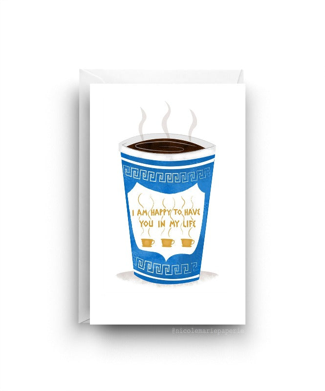 White card. Tall blue cup of coffee with steam coming out of the top. Cup has a design on it with the text "I am happy to have you in my life". 